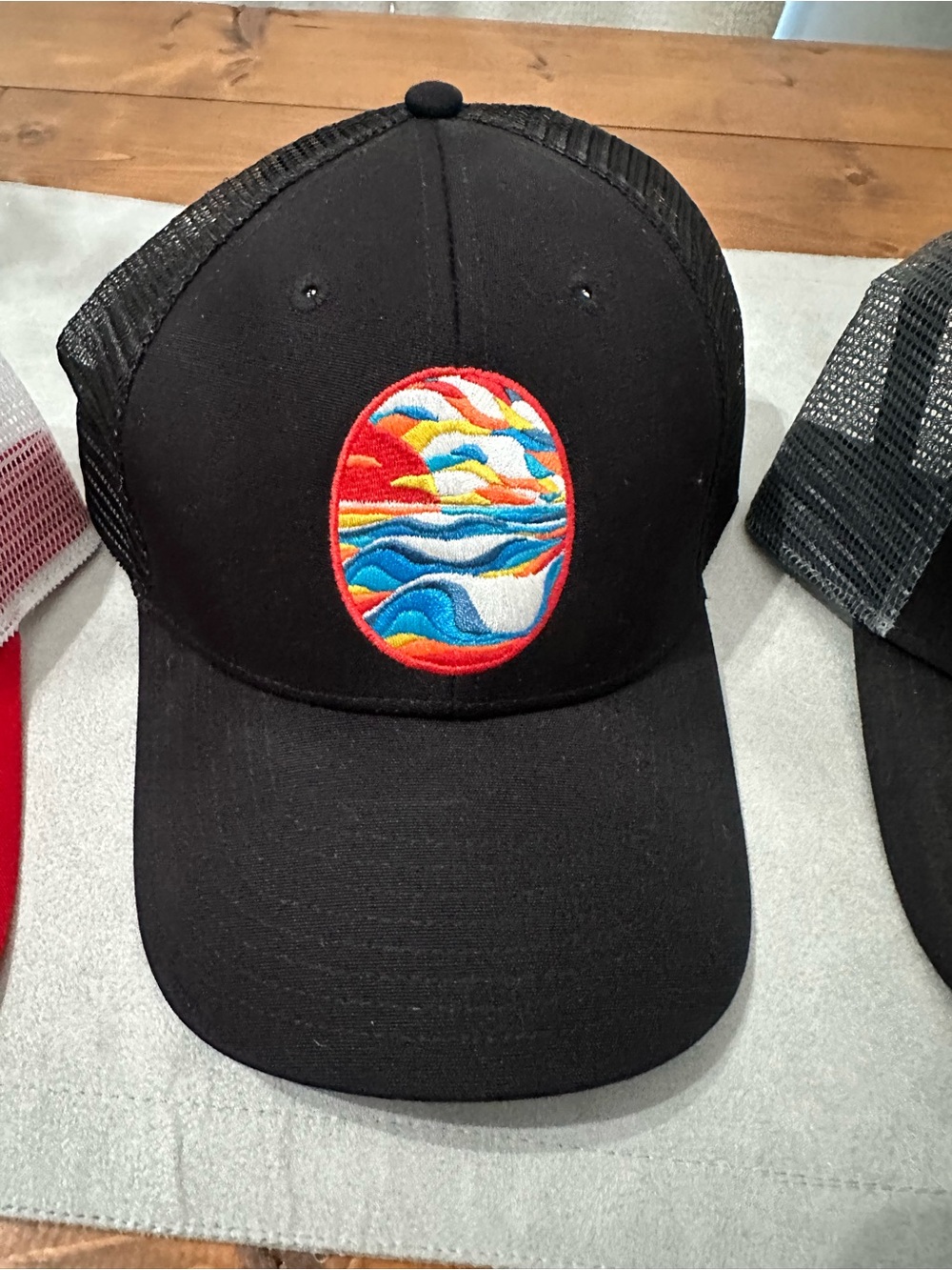 Men's Patagonia Black Trucker Hats with Multicolor Wave Patch and Mountain Patch